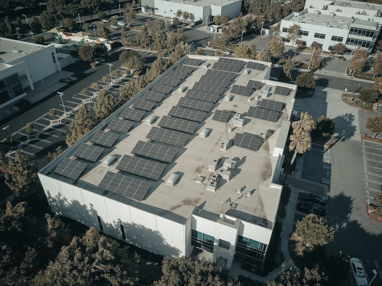Arial photo of solar panels on a commercial building roof
